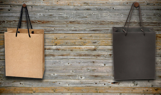 shopping bags hang on wooden wall
