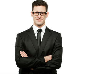 Handsome businessman in black suit on white.