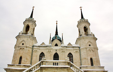 Fototapeta na wymiar White stone church built in russian gothic style (pseudo gothic)