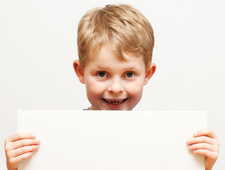 boy holding  sign