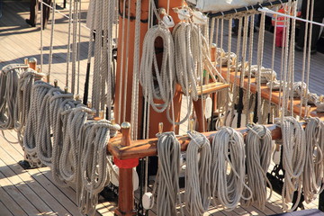 ropes wrapped around the main mast of a sailboat