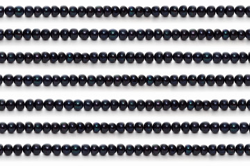 Straight lines of black pearls