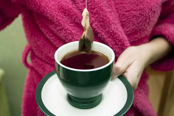 Tea bag with a cup of tea