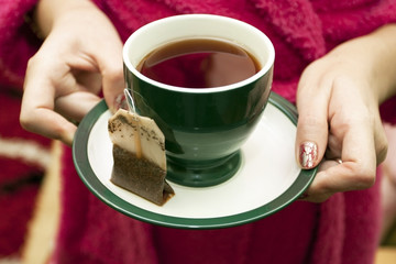 Tea bag with a cup of tea