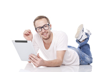 Smart Nerd Man With Tablet Computer lying on the floor