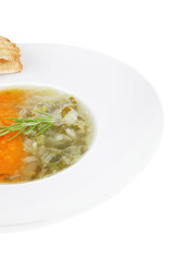 vegetable soup served with toasts on white dish