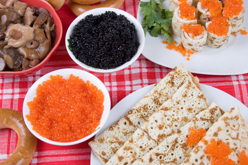 Pancakes with red and black caviar.