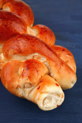 challah over blue painted wooden board