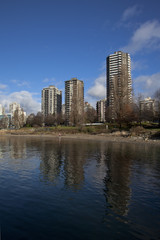 Fototapeta na wymiar downtown highrises reflect off of english bay waters, vancouver