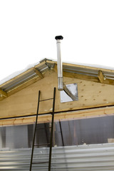 wooden house wiht heating pipe in winter