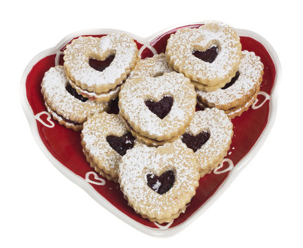 Heart shaped plate covered with heart shaped cookies