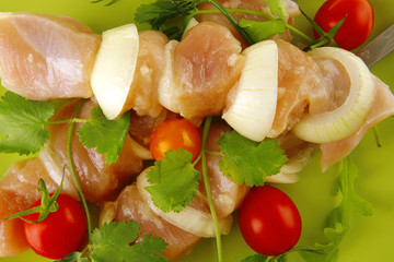 fresh chicken kebabs on dark