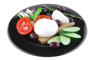 mozzarella cheese on black dish