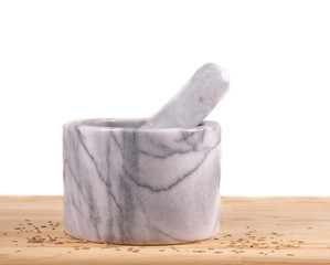 mortar and pestle with сumin seeds