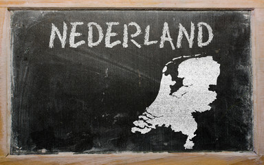 outline map of netherlands on blackboard
