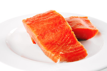 pink smoked salmon on white plate