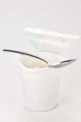 Fototapeta na wymiar yogurt in plastic box container over white background