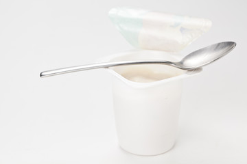 yogurt in plastic box container over white background