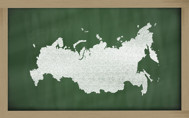 outline map of russia on blackboard