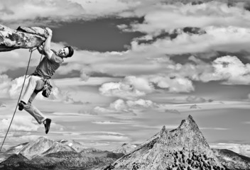 Dangling from the edge.