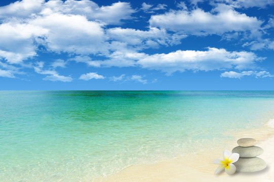 Beautiful remote bech with peble stones tower