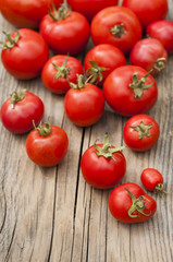 Fresh organic tomatoes on the wooden table