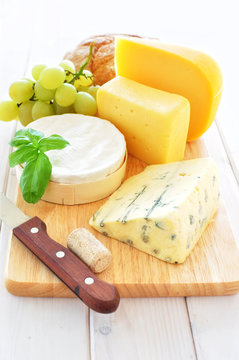 Assortment of cheese on a wooden platter