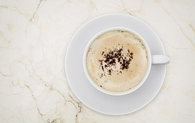 coffee cappuccino, top view on marble table