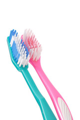 Close Up of 2 Toothbrushes Against white Background