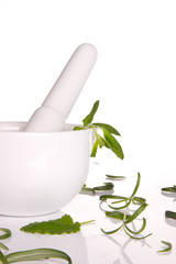 Fresh herbs with mortar