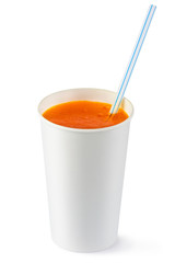 Disposable cup of orange fizzy drink and straw