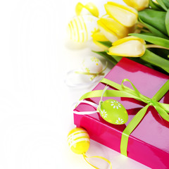 easter eggs with yellow tulip flowers and gift box