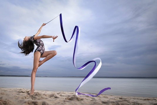 Woman with ribbon for rhythmic gymnastic. Workout sports