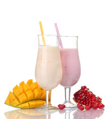 Milk shakes with fruits isolated on white