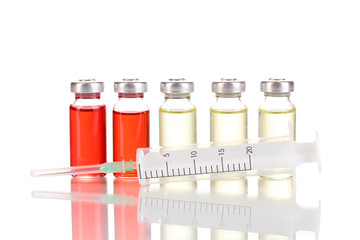 Syringe and medical ampoules isolated on white
