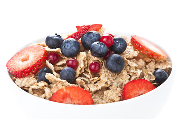 cereals bowl with red fruits isolated on white
