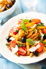 Penne with cherry tomatoes, olives and pesto