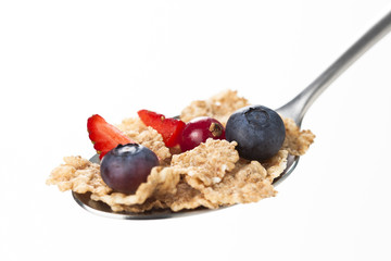 cereals bowl with red fruits isolated on white