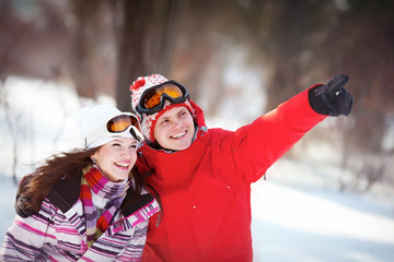 Girl and boy in winter park