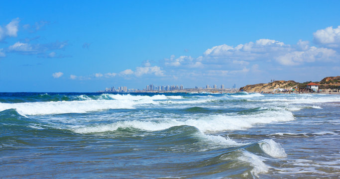 sea, beach and city in the background