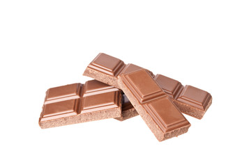 Chocolate pieces on the white background