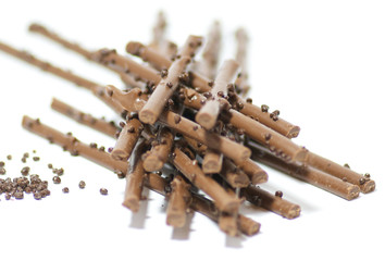 Chocolate sticks with chocolate granules isolated
