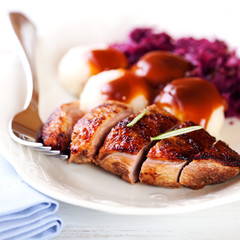 Duck breast with potato dumplings and red cabbage