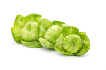 Arrangement of brussels sprouts isolated on white background