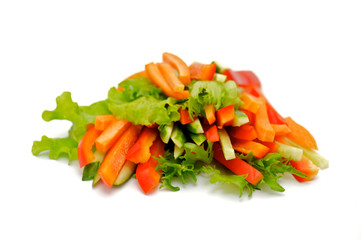 Red Bell pepper, cucumber and carrots straws with salad leaves