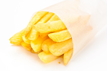 French fries in a paper tube on white