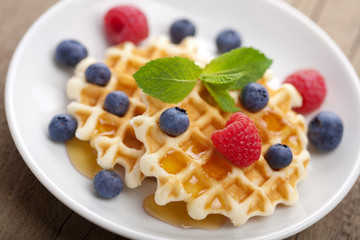 waffles with fresh berries and honey