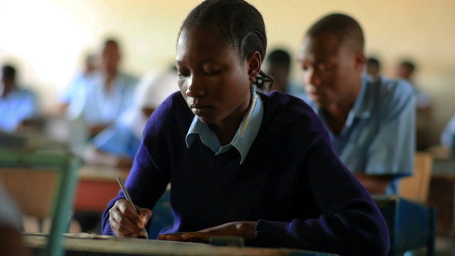 African female student testing in classroom class in Kenya, Africa.