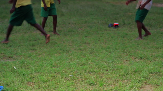 African Boys playing between class in a village in Kenya.
