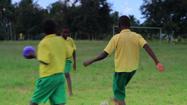 Boys playing between class in a village in Kenya.
